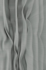 a black and white photo of a curtain