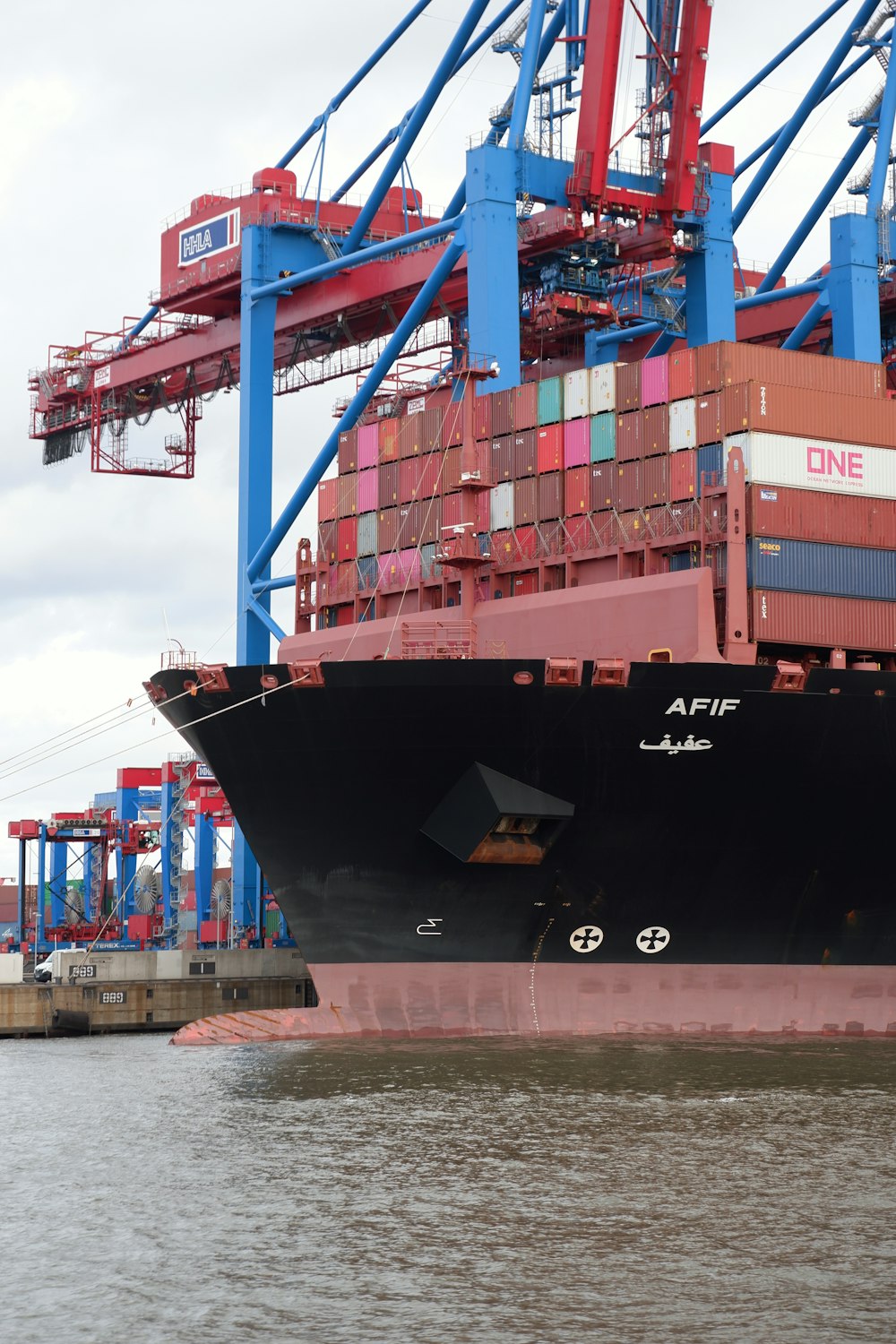 a large cargo ship docked at a dock