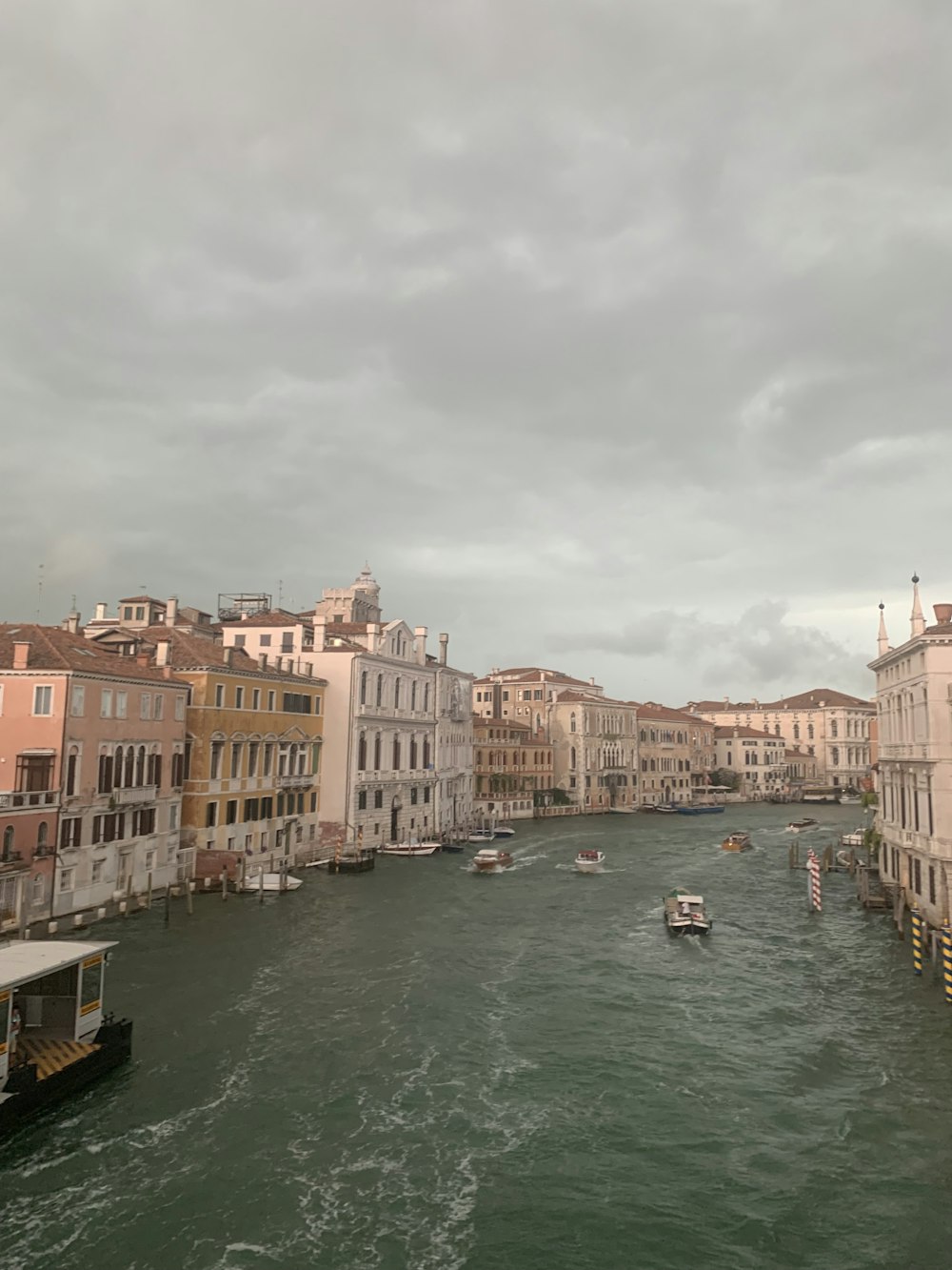 a river running through a city next to tall buildings