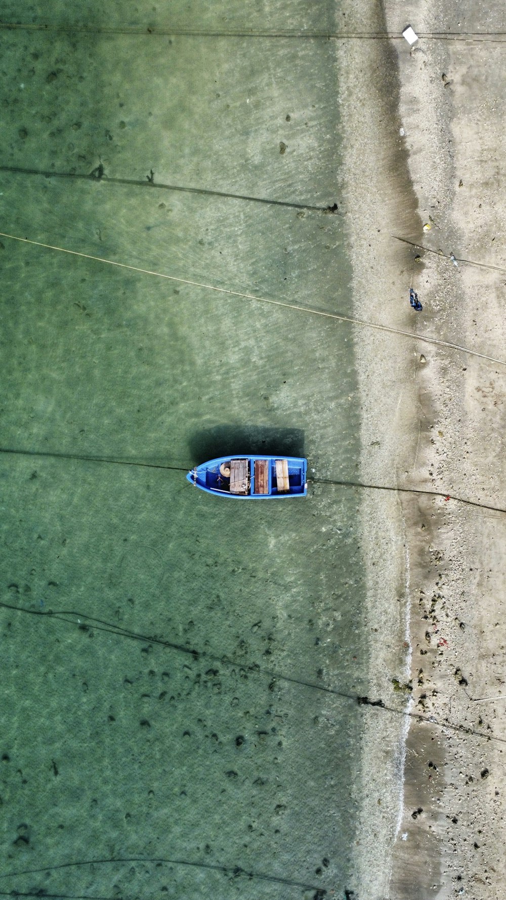 a small boat floating on top of a body of water