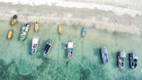 a number of small boats in a body of water