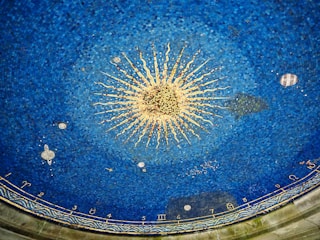 a blue ceiling with a starburst in the middle of it