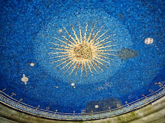 a blue ceiling with a starburst in the middle of it