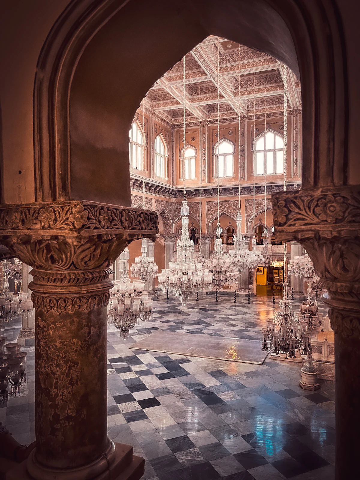 Intimate hall with chandeliers and checkered floor