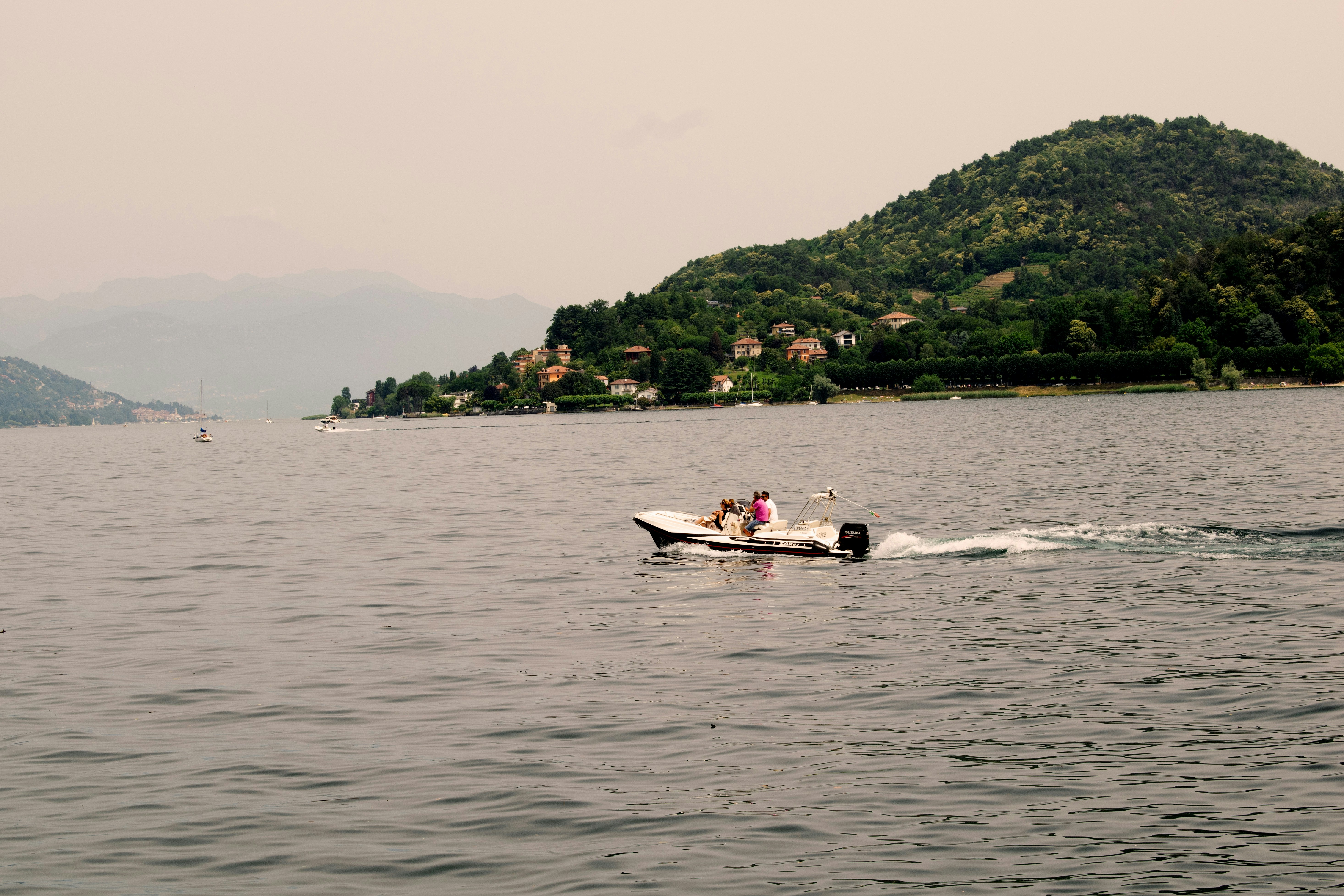 a couple of people on a boat in the water