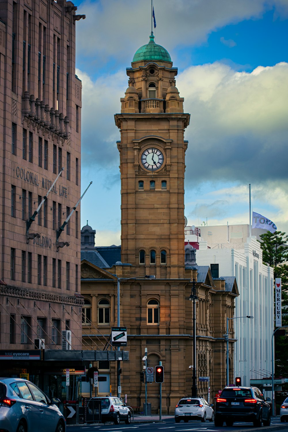 a tall clock tower towering over a city street