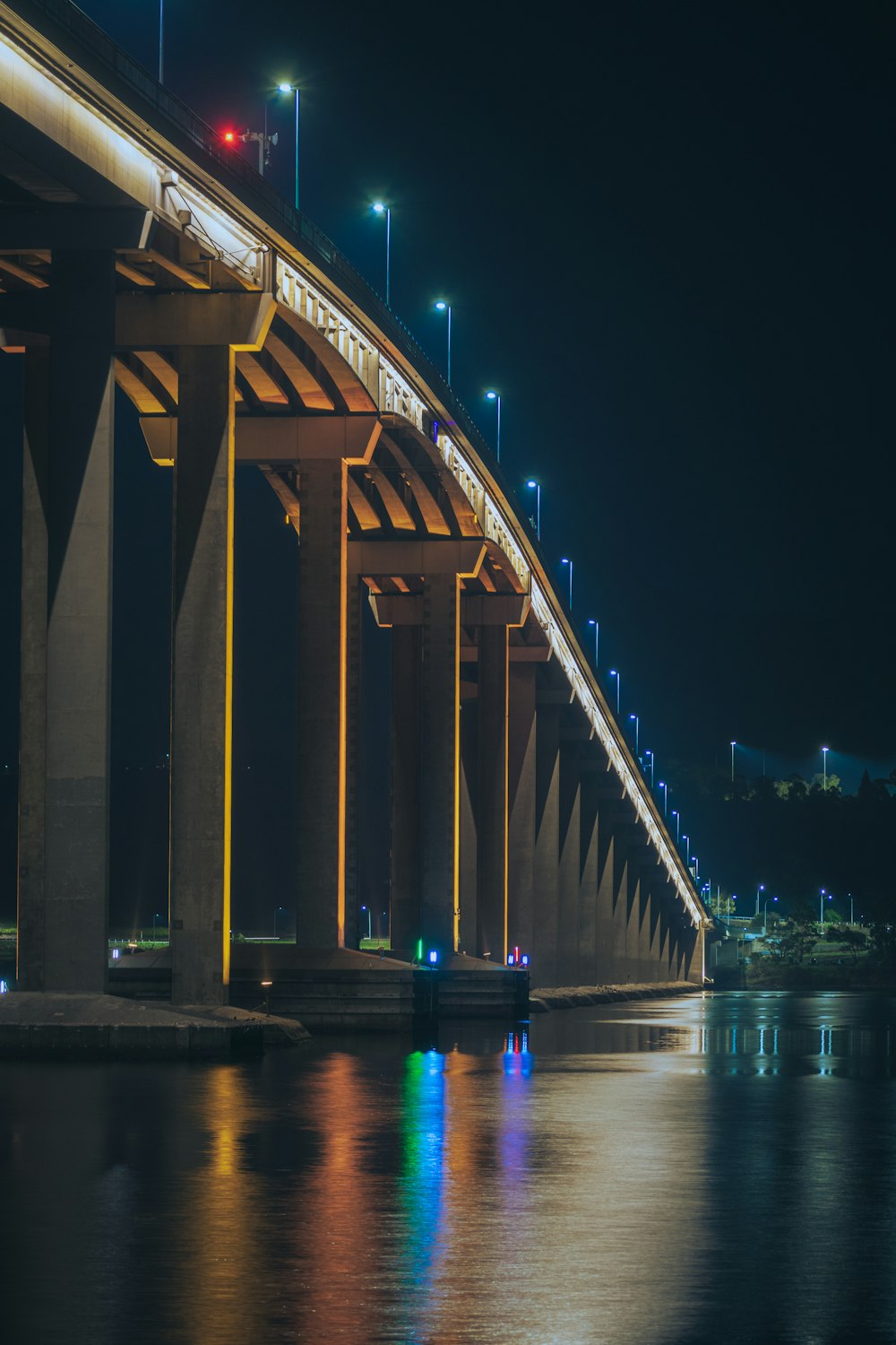 a bridge over a body of water at night