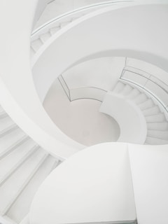 a man riding a skateboard down a set of stairs
