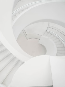 a man riding a skateboard down a set of stairs