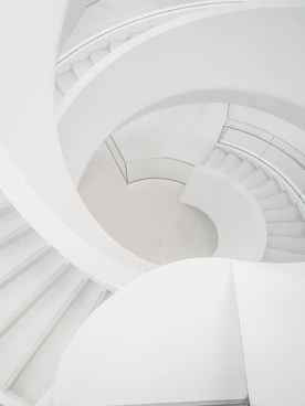 a man riding a skateboard down a set of stairs