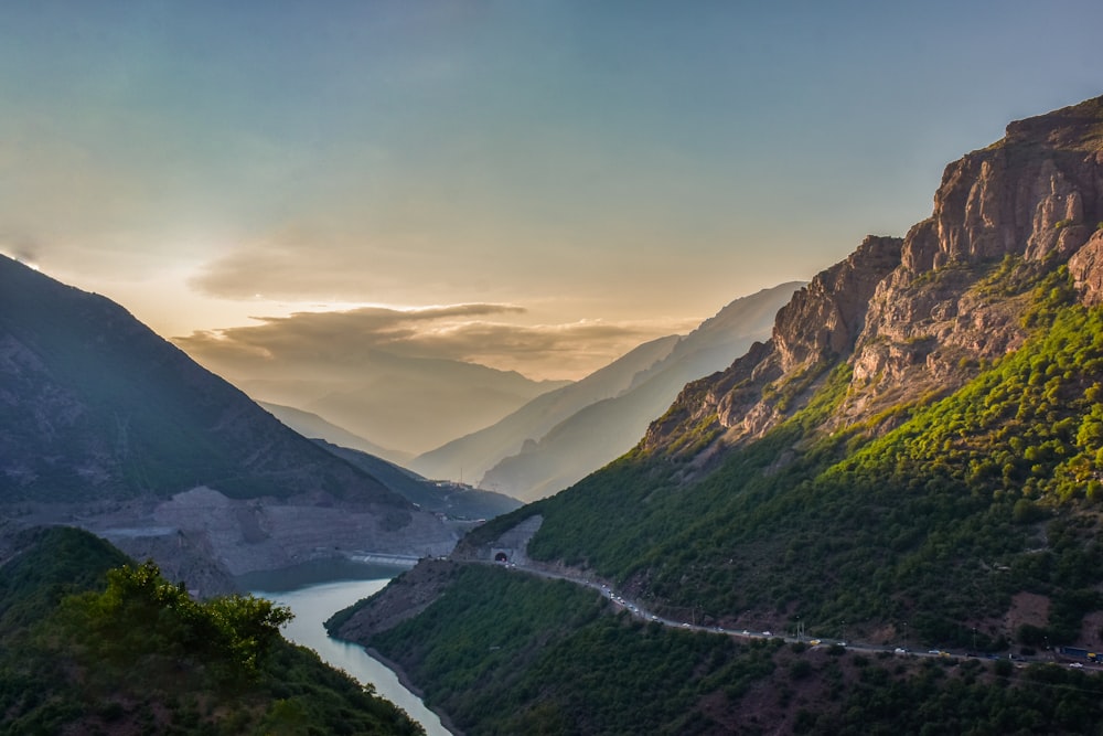 a scenic view of a valley with a river running through it