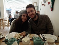 A cozy café setting with couples enjoying their time together.