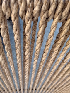 a close up of a rope with a blue background