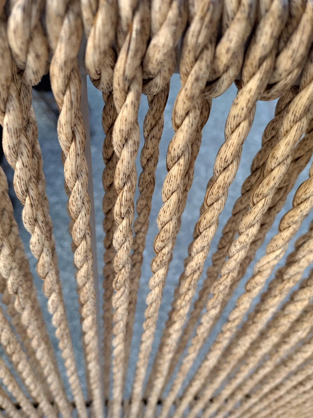 a close up of a rope with a blue background