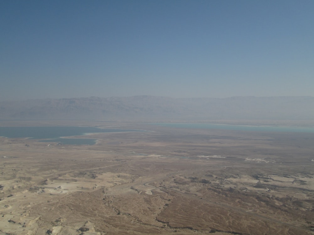 an aerial view of the dead sea and mountains