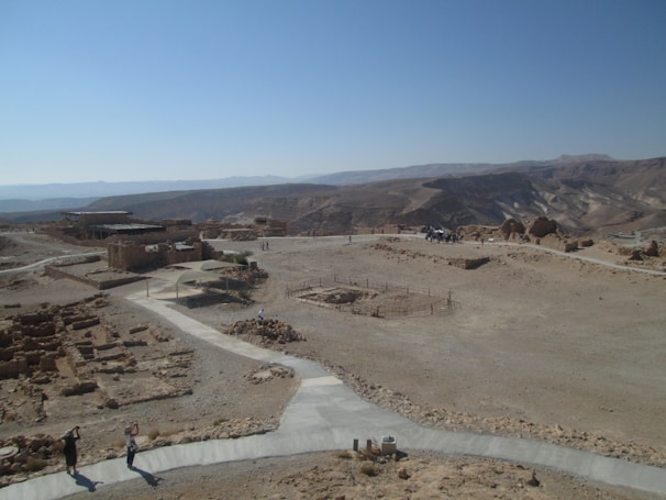 Participants exploring ancient ruins in the desert.