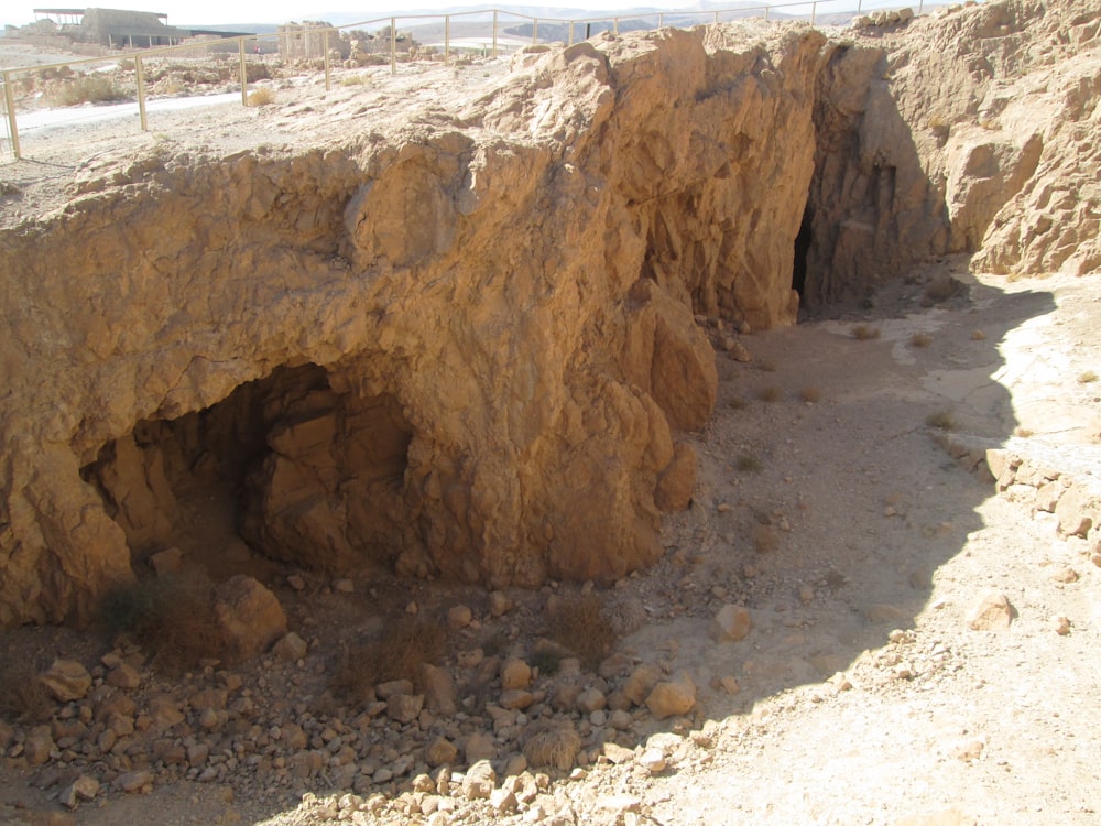 a rocky outcropping in the middle of a desert