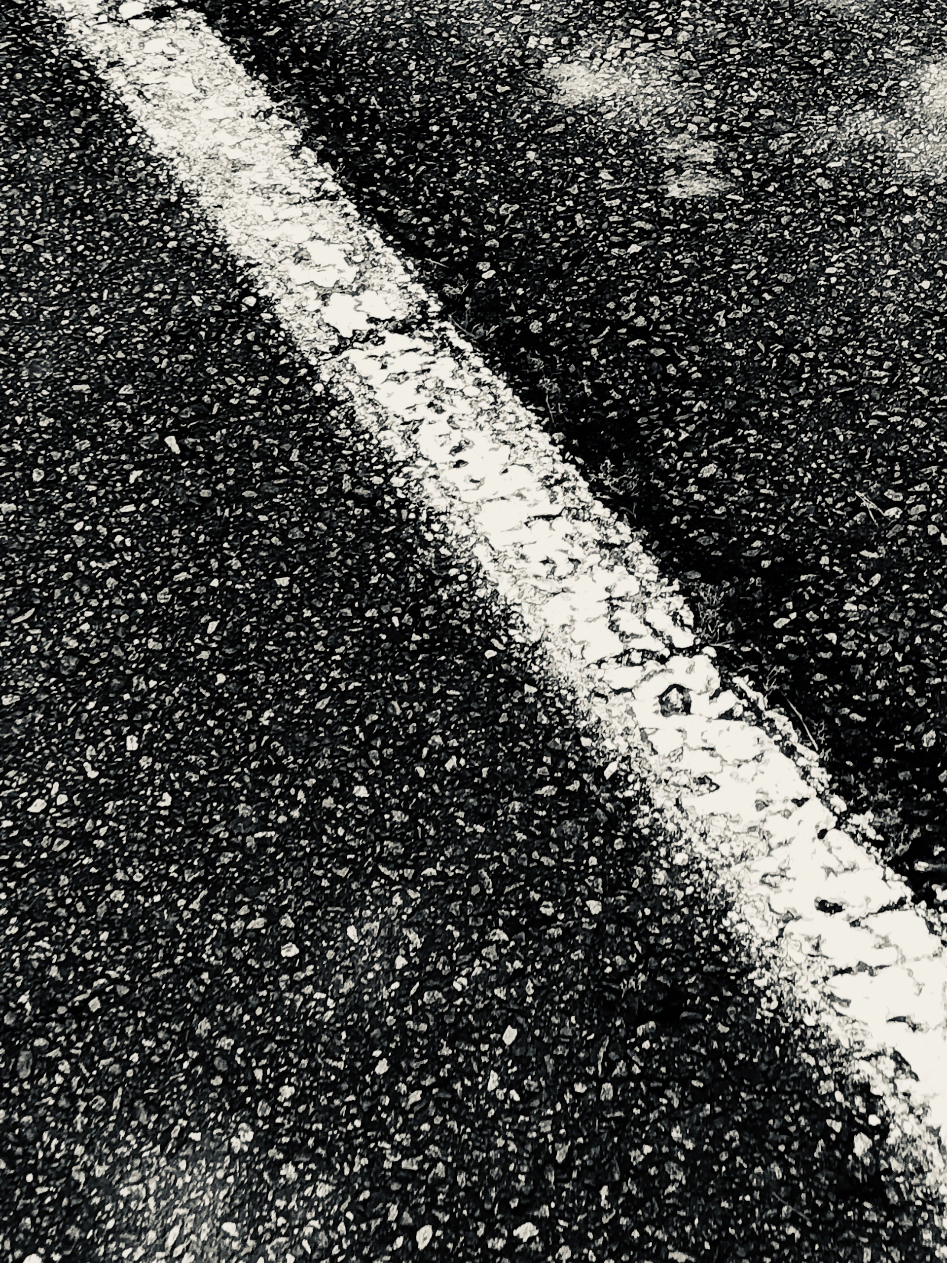 a black and white photo of an empty street