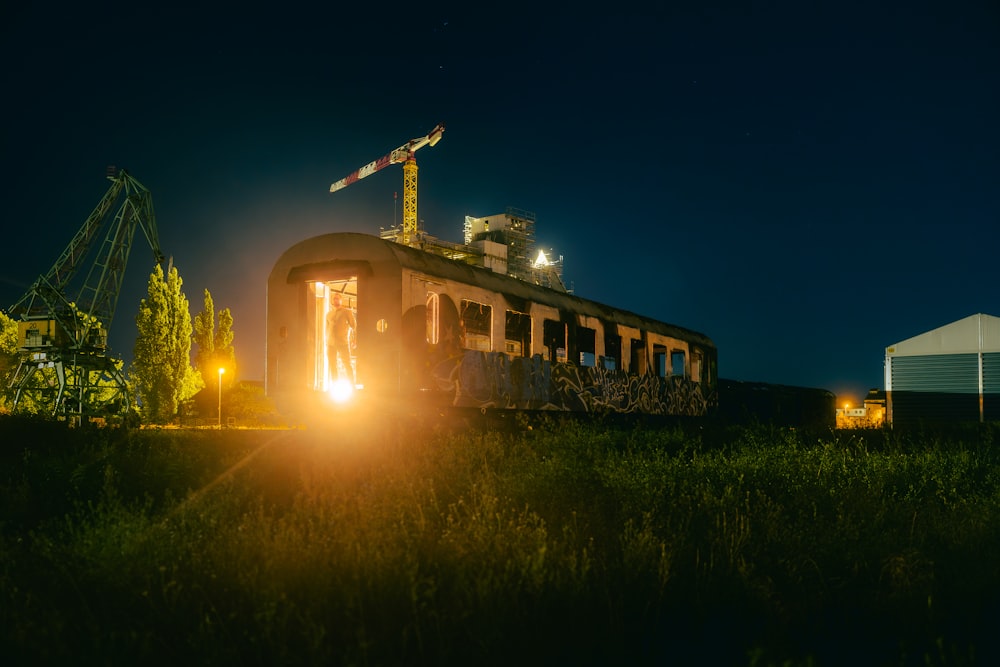 a train traveling through a rural countryside at night