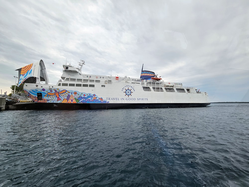 a large white ferry boat in the water