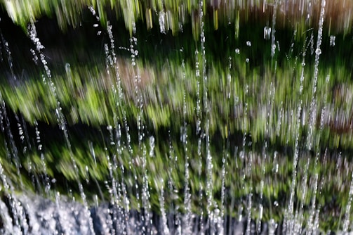 A cinematic still from an upcoming Vimaxfilms production featuring rain streak effects.