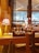 A cozy restaurant table set for dining with soft lighting and elegant tableware.