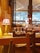 A cozy restaurant table set for dining with soft lighting and elegant tableware.