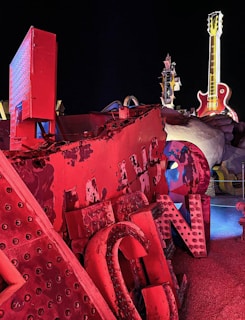 Array of repaired appliances lined up against a backdrop of Vegas neon signs
