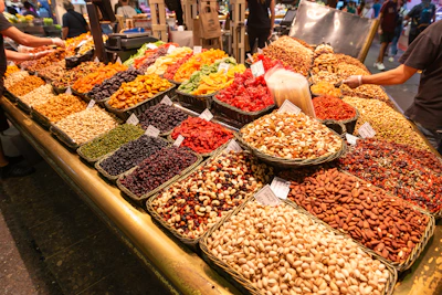 Assorted dry fruits like almonds, cashews, and raisins displayed in rustic baskets.
