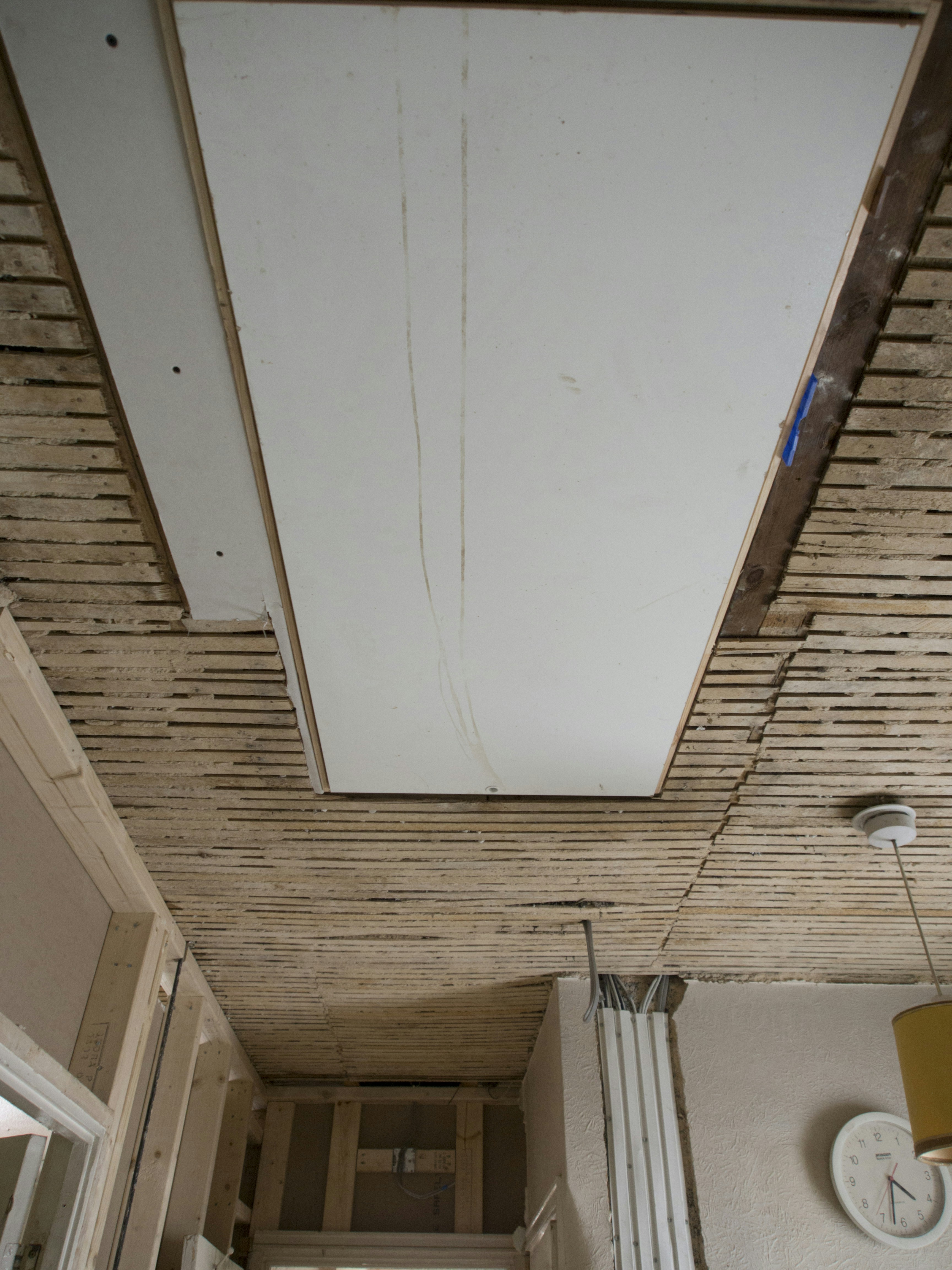 a room with a ceiling that has been stripped off