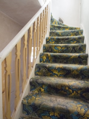 A pristine stairway carpet after Excel Carpet Cleaning Services treatment.