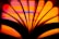 An abstract close-up of a book's pages fanned out against a vibrant, multicolored background. The pages create dark silhouettes that contrast with the orange, pink, and purple hues in the background, forming a visually striking pattern.