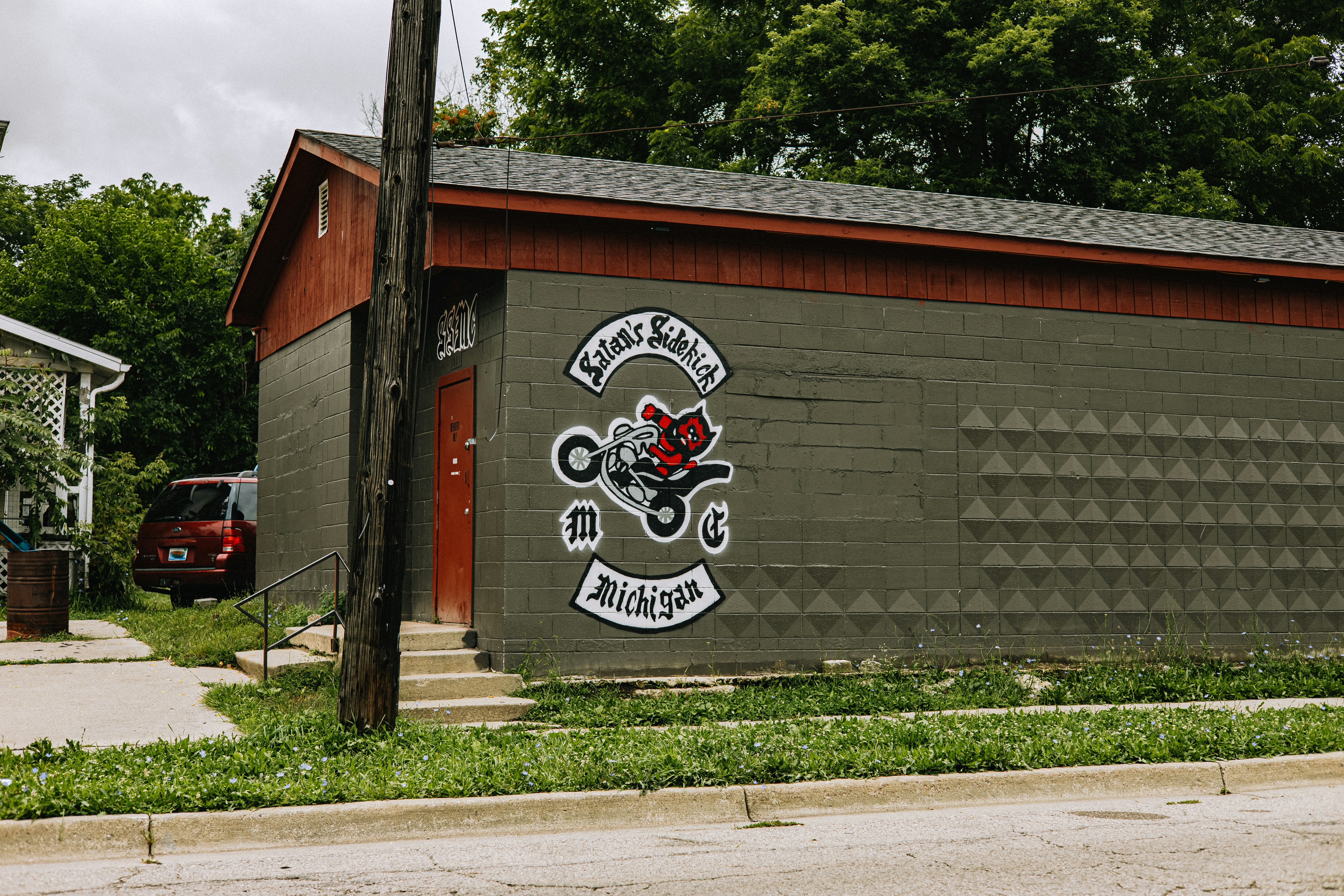 a garage with a motorcycle painted on the side of it