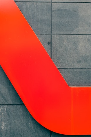 A vibrant kitchen backsplash painted in bold red, highlighting clean edges and attention to detail.