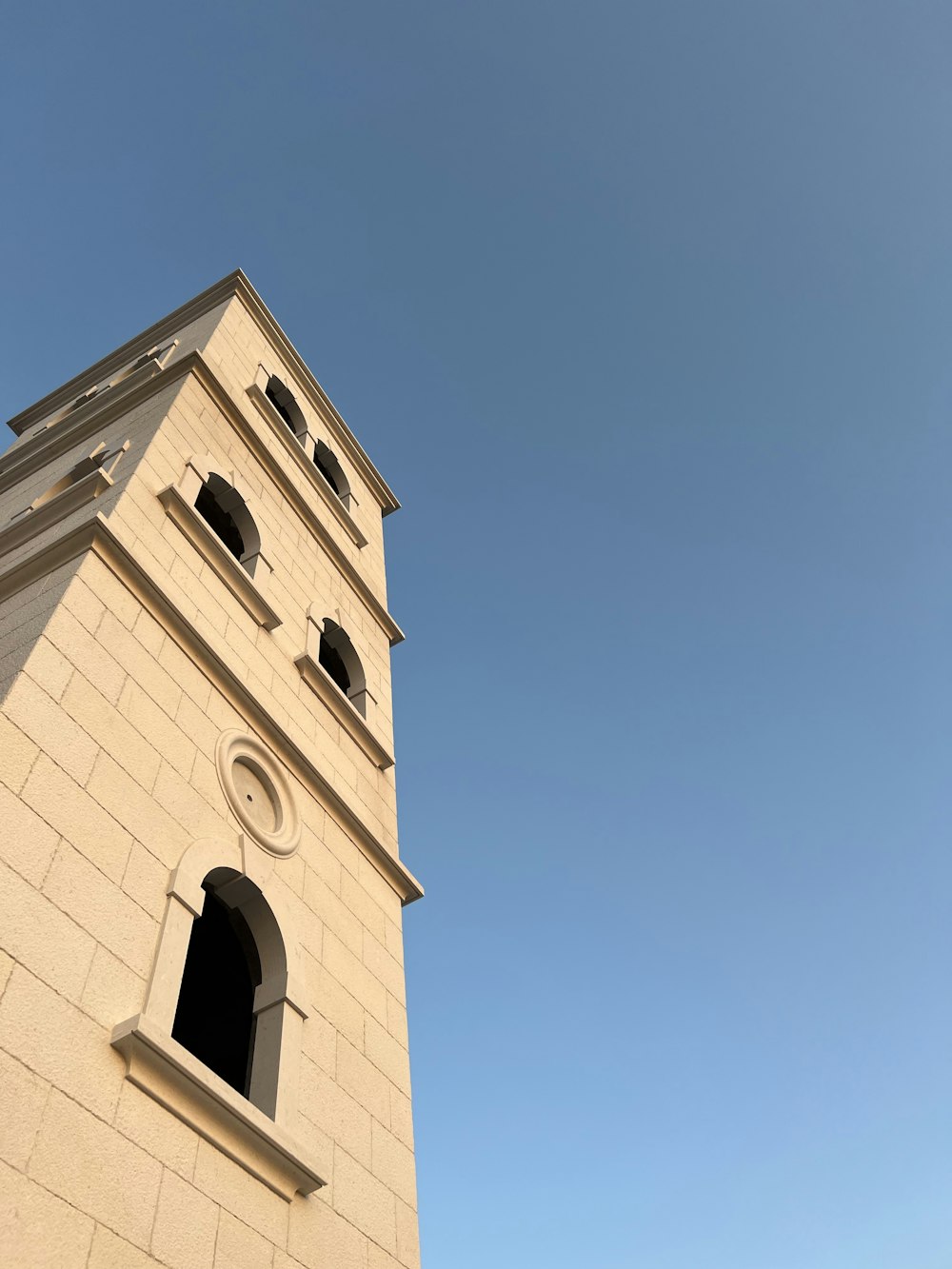 a tall tower with a clock on the top of it