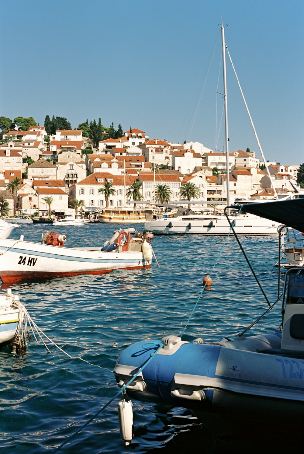 a group of boats floating on top of a body of water