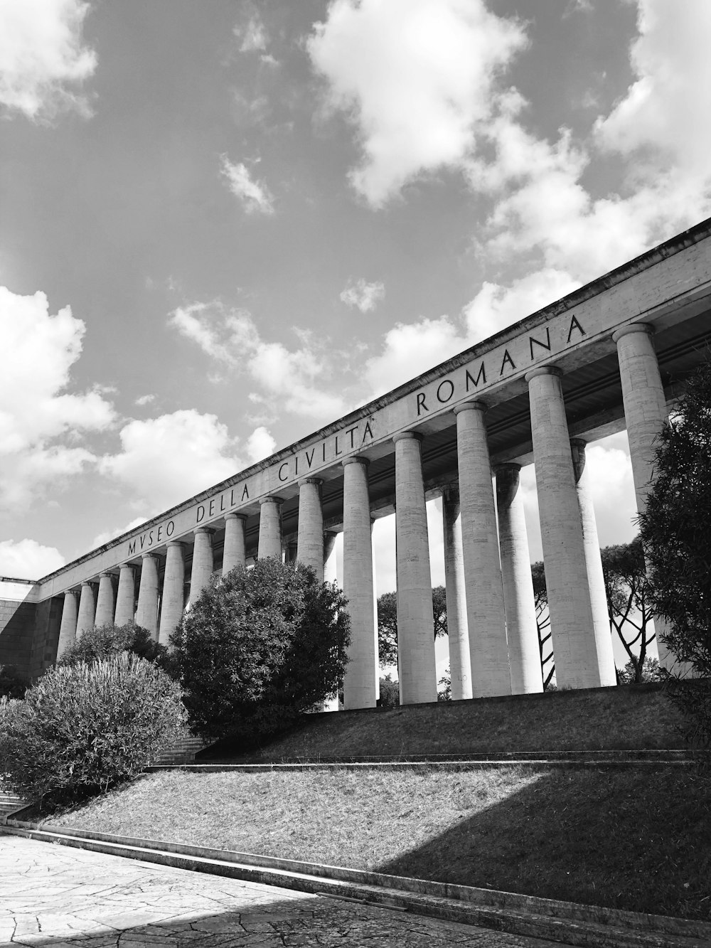 a black and white photo of a roman temple