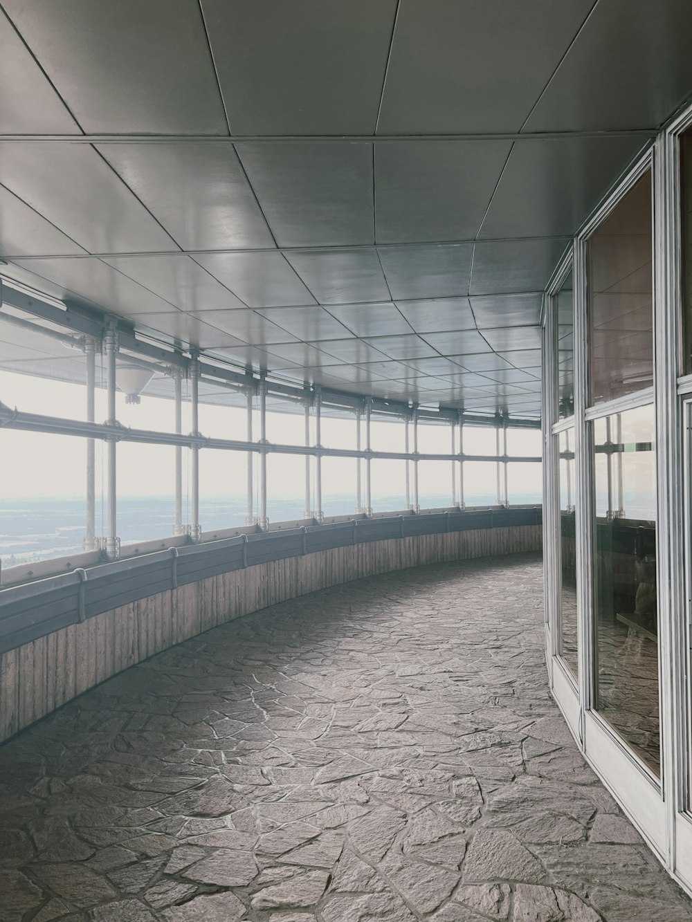 an empty room with a view of the ocean