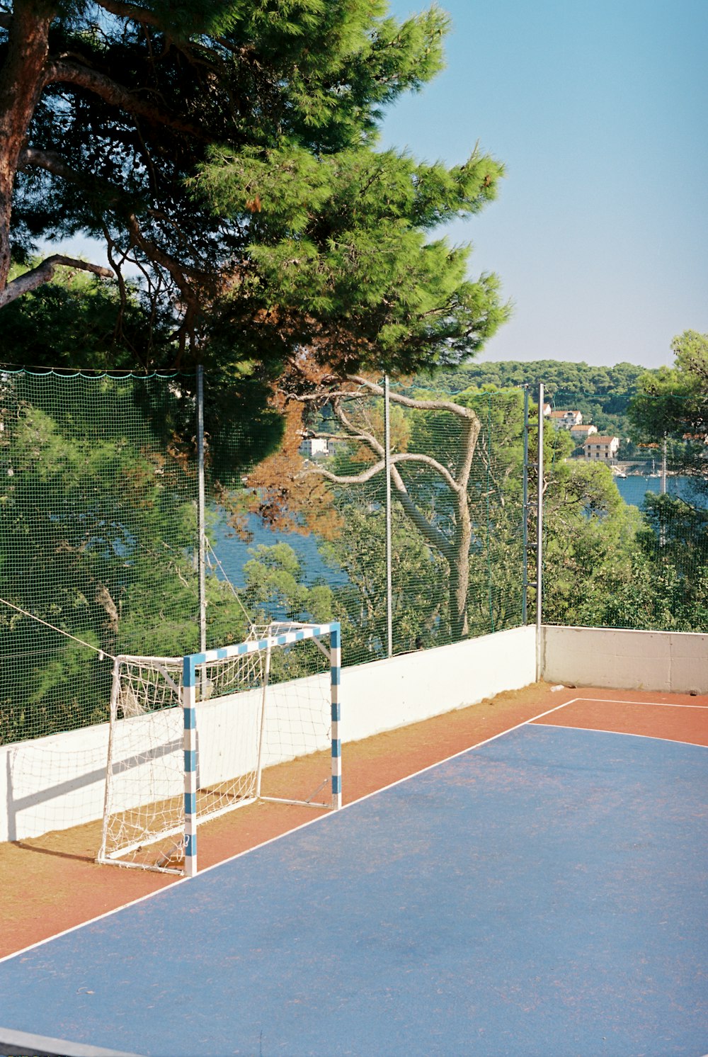 a tennis court with a net and a goal