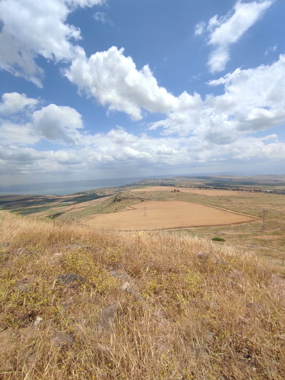 a view of a field from a hill