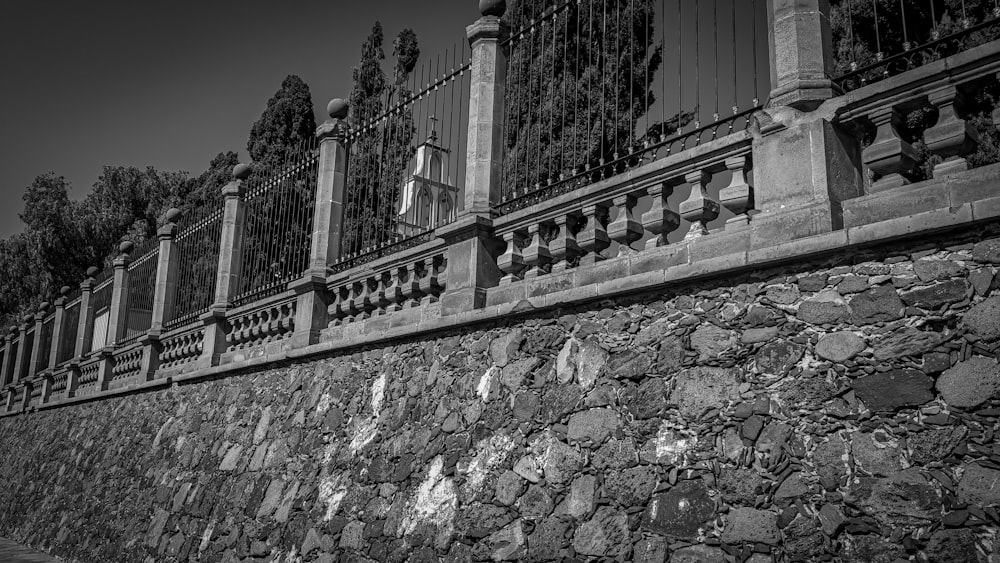 a black and white photo of a stone wall