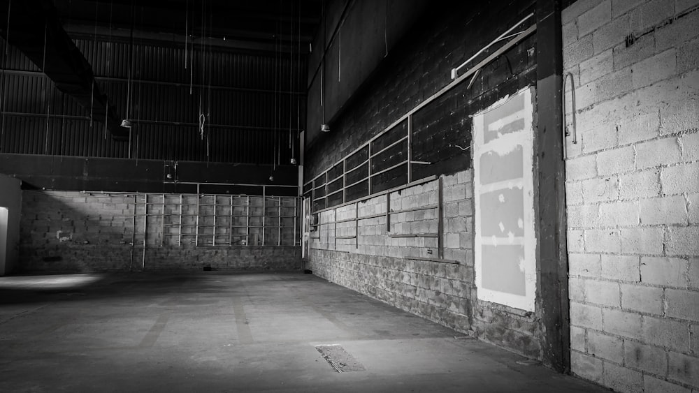 a black and white photo of an empty warehouse