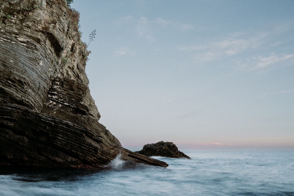 a rock outcropping in the middle of the ocean