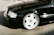 Shiny sedan parked on a clean driveway after a thorough mobile detailing session.