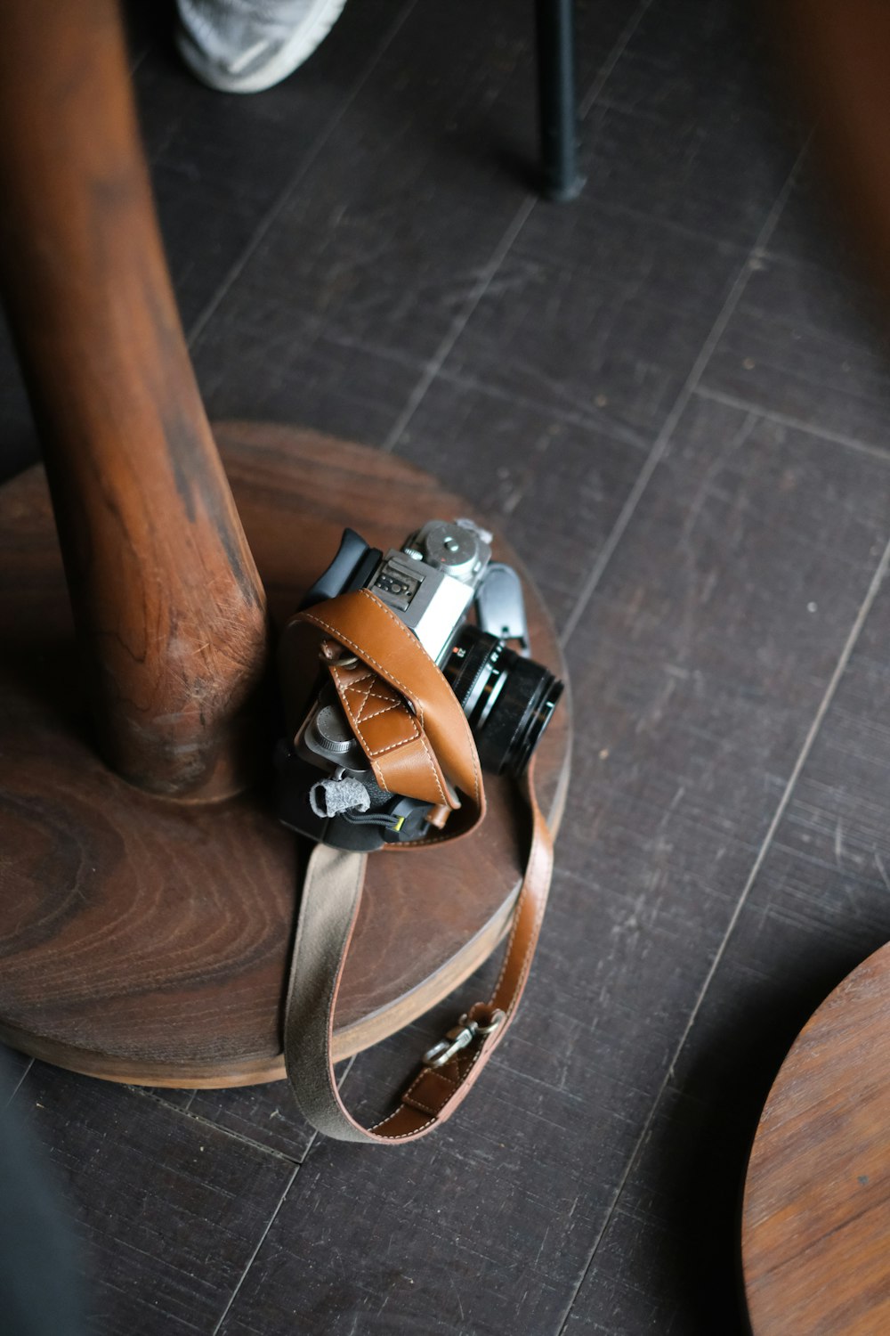 a camera sitting on top of a wooden table