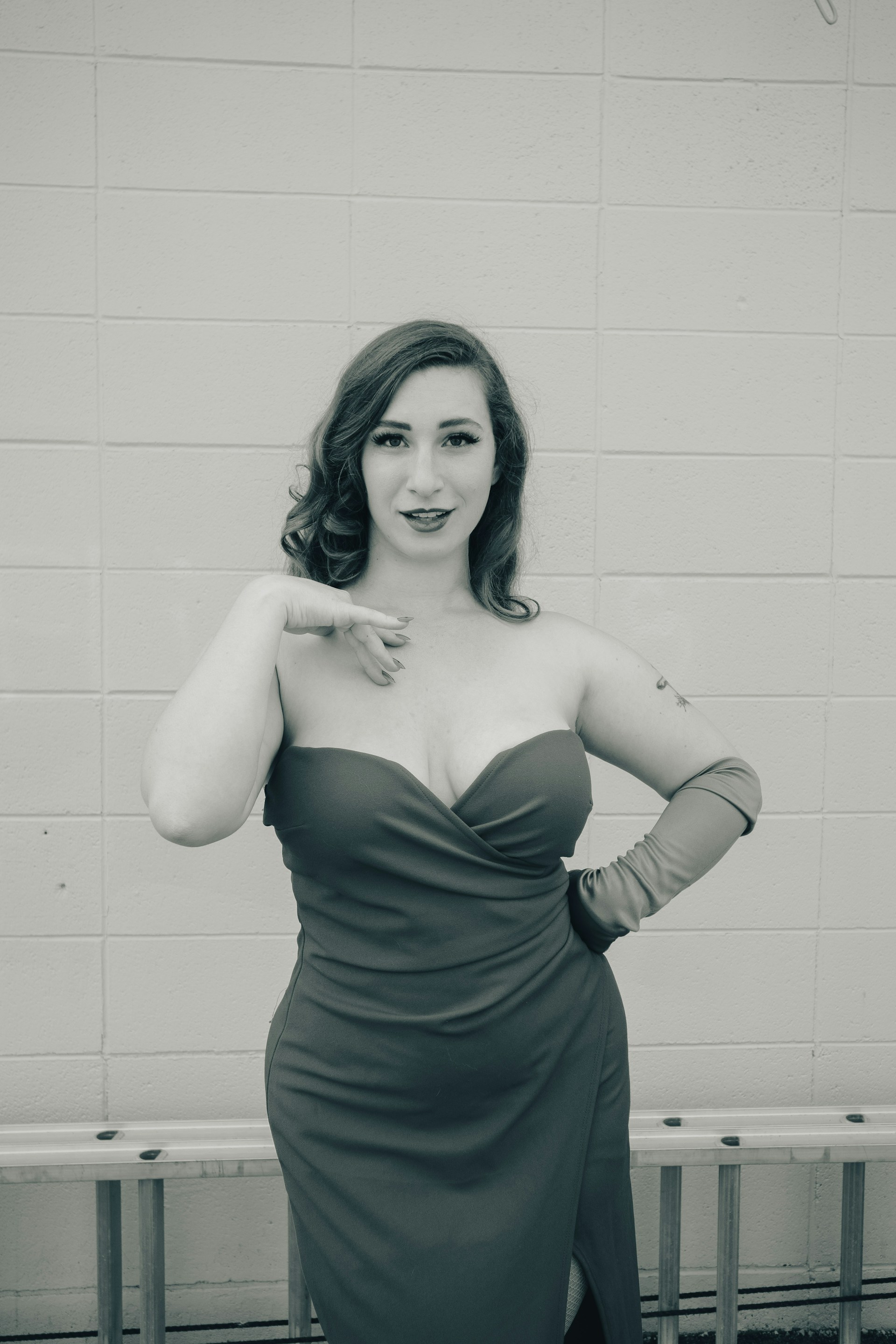 a woman in a dress posing for a picture
