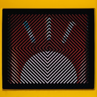 Close-up of custom dot shapes showing square and pincushion variations.