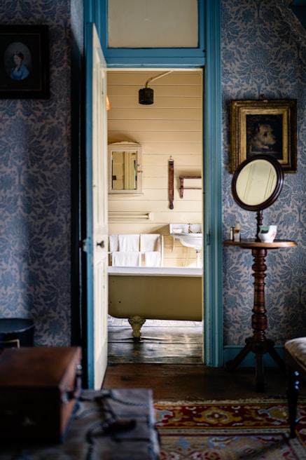 Classic clawfoot bathtub with vintage charm set against a tiled wall