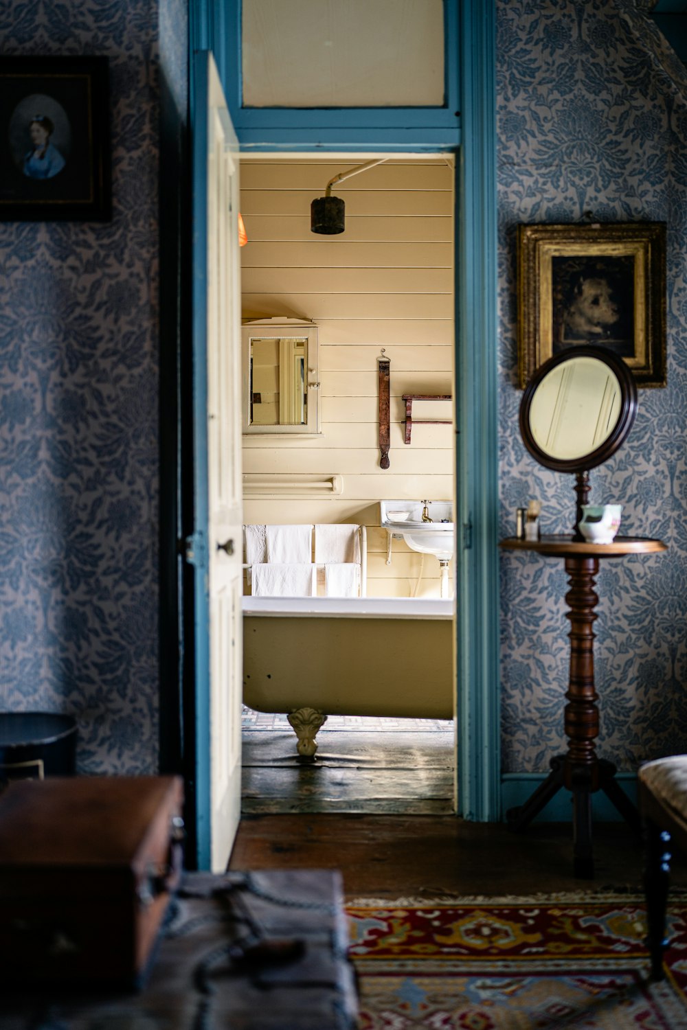 a doorway leading to a bathroom with a bathtub