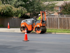 a man on a street working on a road